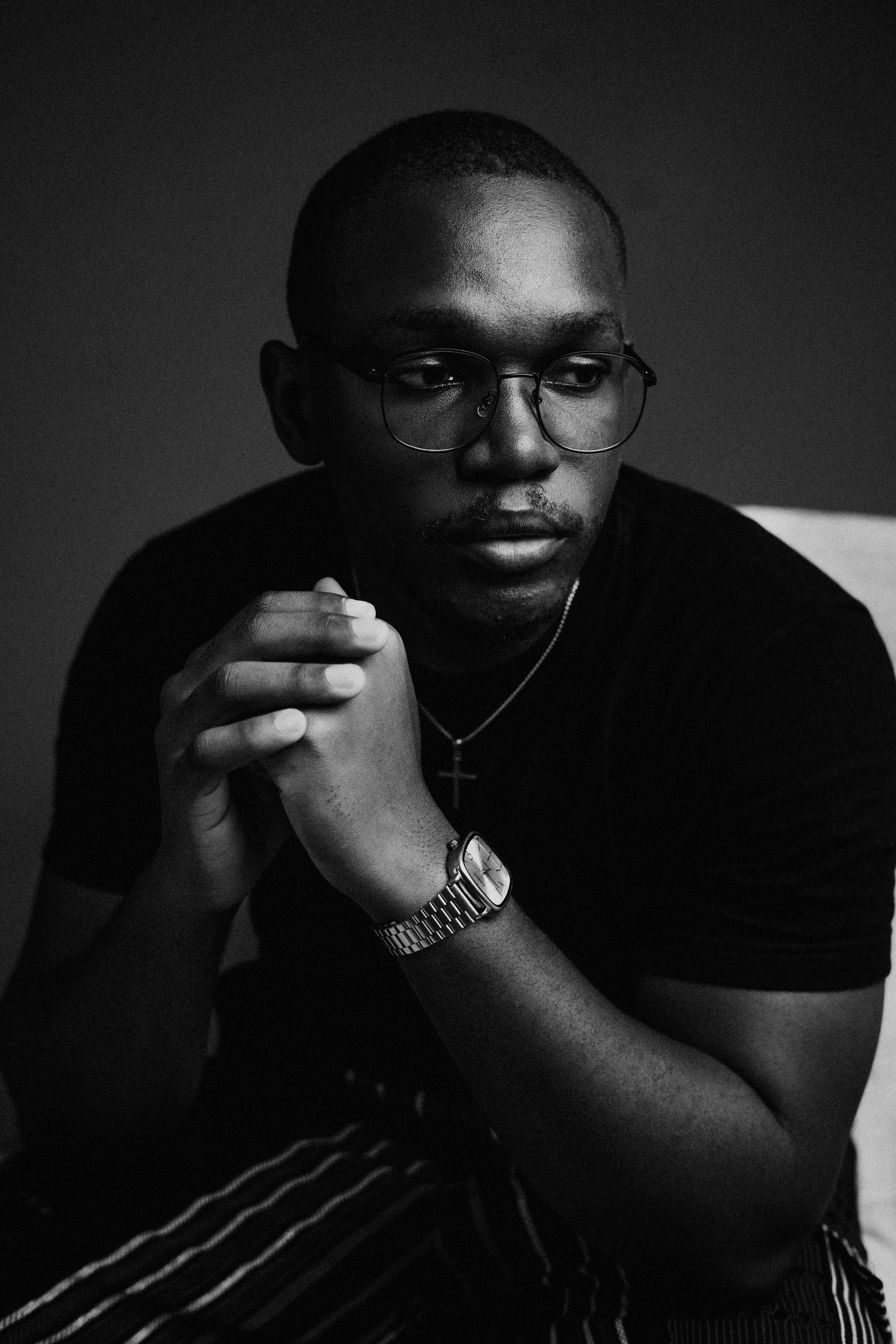 Portrait of Peter Madu holding a medium format camera
